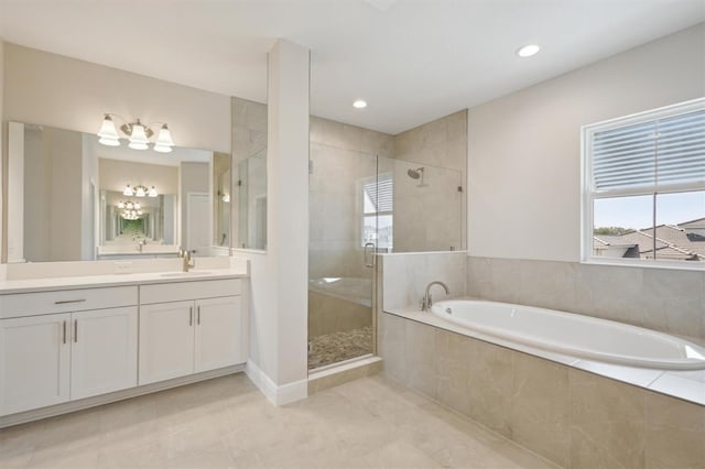10320 Longmeadow Ave, Parrish, FL 34219 - full bathroom with a garden tub, vanity, a shower stall, a chandelier, and recessed lighting