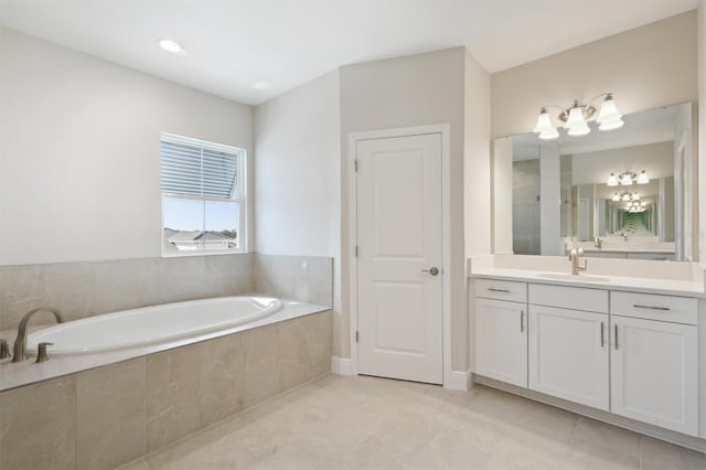 10320 Longmeadow Ave, Parrish, FL 34219 - bathroom with vanity, a garden tub, and tile patterned flooring