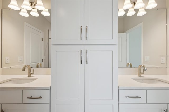 10320 Longmeadow Ave, Parrish, FL 34219 - full bath featuring double vanity and a chandelier