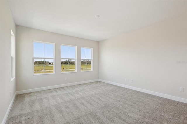 10320 Longmeadow Ave, Parrish, FL 34219 - spare room featuring carpet floors and baseboards