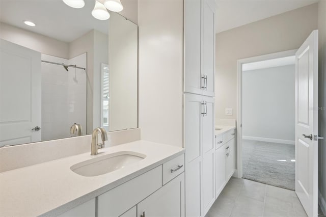 10320 Longmeadow Ave, Parrish, FL 34219 - bathroom with vanity, tile patterned floors, tiled shower, and recessed lighting