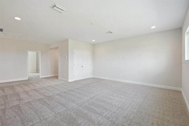 10320 Longmeadow Ave, Parrish, FL 34219 - empty room with light carpet, recessed lighting, and baseboards