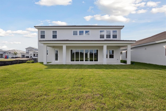 10320 Longmeadow Ave, Parrish, FL 34219 - rear view of house featuring a yard, a patio area, and stucco siding