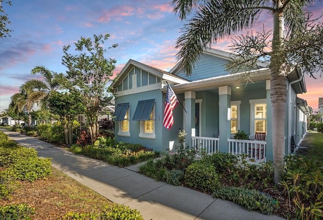 610 Winterside Dr, Apollo Beach, FL 33572 - view of front of house with covered porch and stucco siding