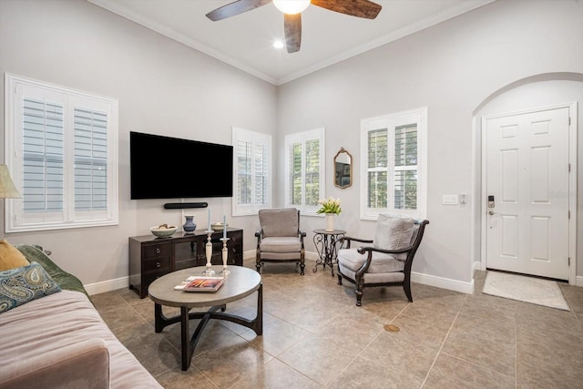 610 Winterside Dr, Apollo Beach, FL 33572 - tiled living area with ornamental molding, baseboards, ceiling fan, and a high ceiling