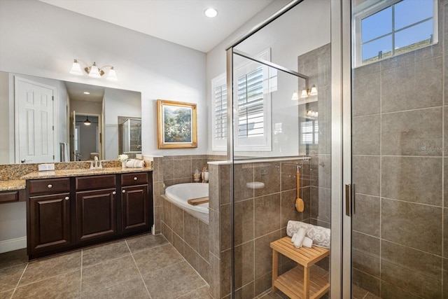 610 Winterside Dr, Apollo Beach, FL 33572 - full bath featuring vanity, a bath, tile patterned floors, and a shower stall