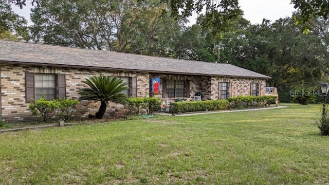 3705 Bruton, Plant City, FL 33565 - ranch-style home featuring a front yard and brick siding