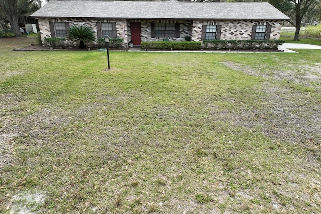 3705 Bruton, Plant City, FL 33565 - view of front of house with a front yard and brick siding