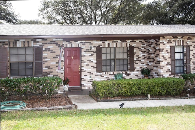 3705 Bruton, Plant City, FL 33565 - property entrance featuring brick siding and a shingled roof