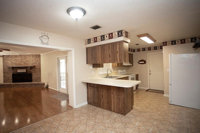 3705 Bruton, Plant City, FL 33565 - kitchen featuring electric stove, light countertops, a sink, a peninsula, and open floor plan