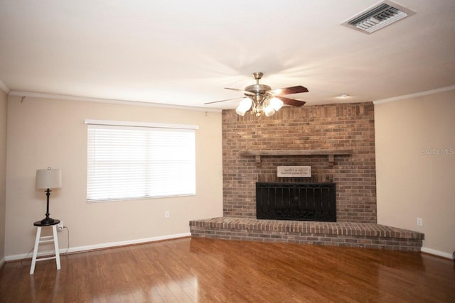 3705 Bruton, Plant City, FL 33565 - unfurnished living room with ceiling fan, wood finished floors, baseboards, a fireplace, and ornamental molding