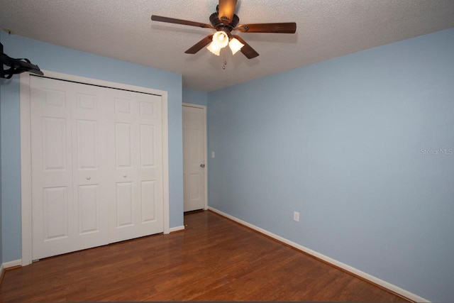 3705 Bruton, Plant City, FL 33565 - unfurnished bedroom featuring wood finished floors, baseboards, a closet, a textured ceiling, and a ceiling fan