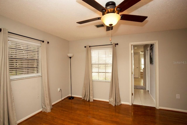 3705 Bruton, Plant City, FL 33565 - unfurnished bedroom featuring wood finished floors, baseboards, and ensuite bathroom