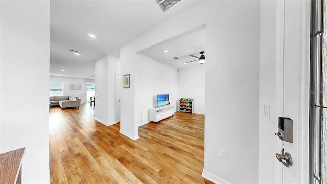 9293 Rally Spring Loop, Wesley Chapel, FL 33545 - hallway featuring recessed lighting, light wood finished floors, and baseboards