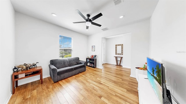 9293 Rally Spring Loop, Wesley Chapel, FL 33545 - living area featuring light wood-style floors, ceiling fan, baseboard heating, baseboards, and recessed lighting
