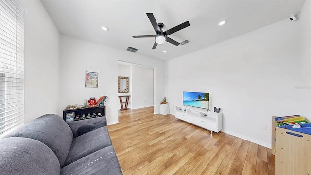 9293 Rally Spring Loop, Wesley Chapel, FL 33545 - living room with light wood finished floors, ceiling fan, recessed lighting, and baseboards