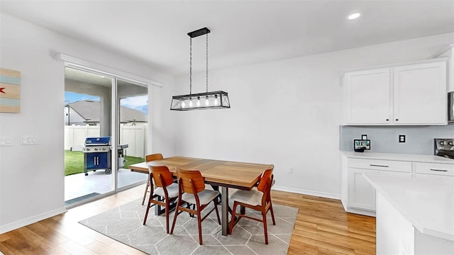 9293 Rally Spring Loop, Wesley Chapel, FL 33545 - dining area featuring light wood-style floors, baseboards, and recessed lighting
