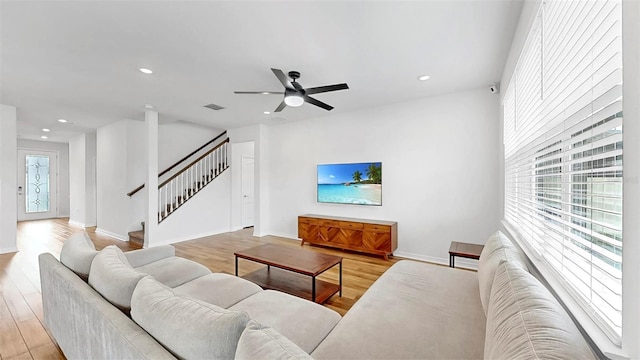 9293 Rally Spring Loop, Wesley Chapel, FL 33545 - living room with recessed lighting, stairs, light wood-style flooring, baseboards, and ceiling fan
