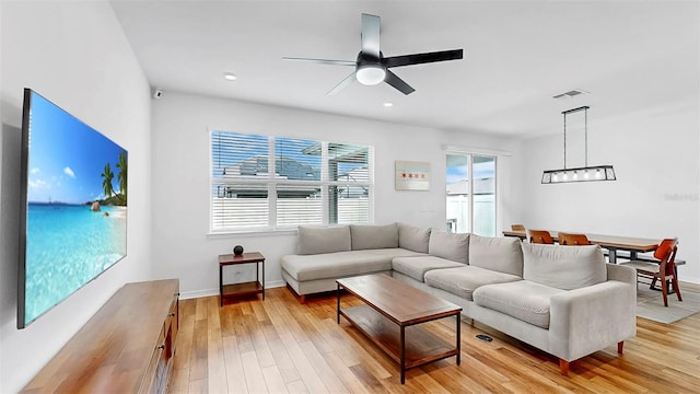 9293 Rally Spring Loop, Wesley Chapel, FL 33545 - living room featuring light wood finished floors, a ceiling fan, baseboards, and recessed lighting