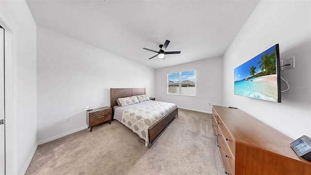 9293 Rally Spring Loop, Wesley Chapel, FL 33545 - bedroom with baseboards, light colored carpet, and a ceiling fan