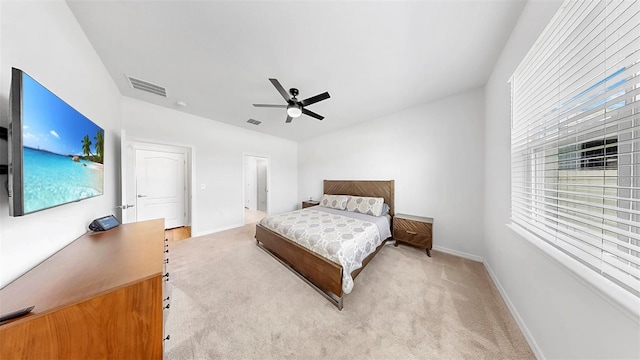 9293 Rally Spring Loop, Wesley Chapel, FL 33545 - bedroom with light colored carpet, baseboards, and ceiling fan