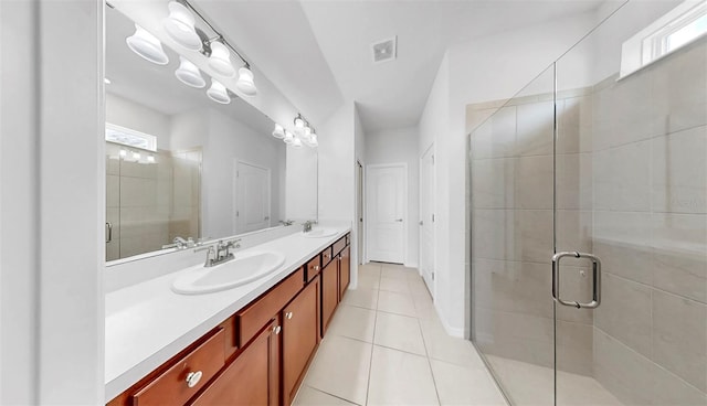 9293 Rally Spring Loop, Wesley Chapel, FL 33545 - full bathroom featuring double vanity, plenty of natural light, tile patterned floors, and a stall shower
