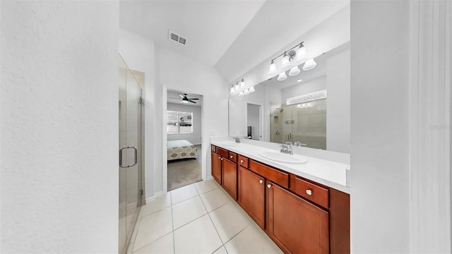 9293 Rally Spring Loop, Wesley Chapel, FL 33545 - bathroom featuring double vanity, a shower stall, tile patterned floors, a ceiling fan, and ensuite bath