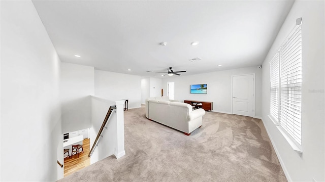 9293 Rally Spring Loop, Wesley Chapel, FL 33545 - living room featuring light carpet, plenty of natural light, a ceiling fan, and recessed lighting