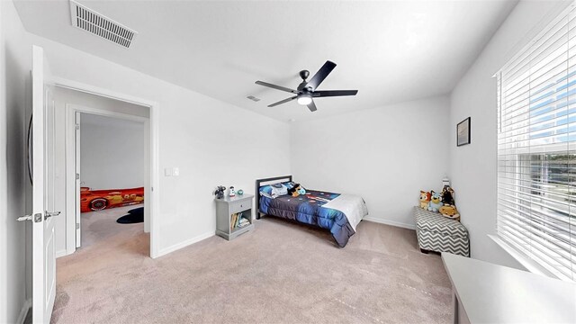 9293 Rally Spring Loop, Wesley Chapel, FL 33545 - bedroom featuring light colored carpet, ceiling fan, and baseboards