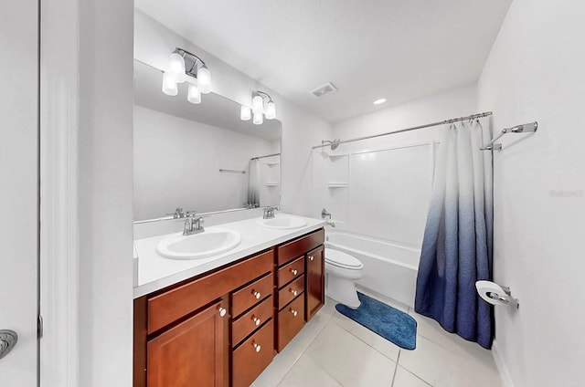 9293 Rally Spring Loop, Wesley Chapel, FL 33545 - full bath with double vanity, toilet, tile patterned floors, and shower / bath combo with shower curtain
