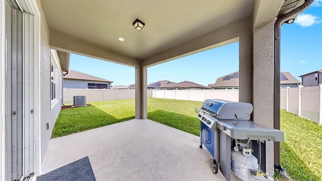 9293 Rally Spring Loop, Wesley Chapel, FL 33545 - view of patio / terrace with central AC unit and a residential view