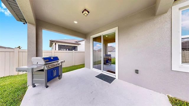 9293 Rally Spring Loop, Wesley Chapel, FL 33545 - view of patio featuring grilling area