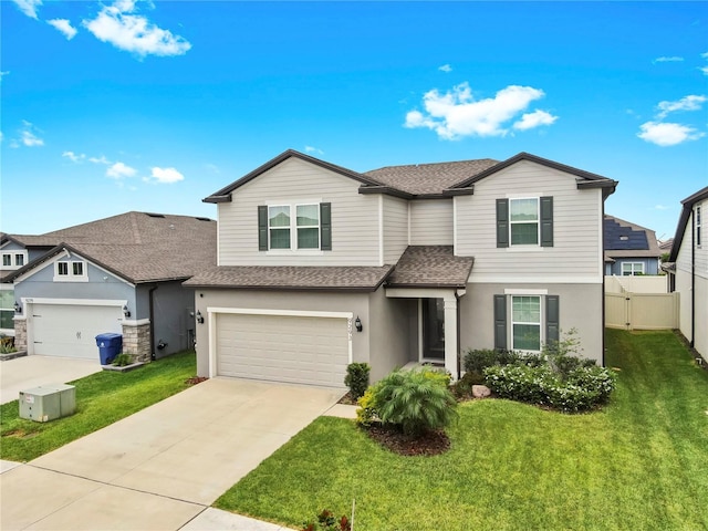9293 Rally Spring Loop, Wesley Chapel, FL 33545 - view of front of house featuring roof with shingles, stucco siding, driveway, and a garage