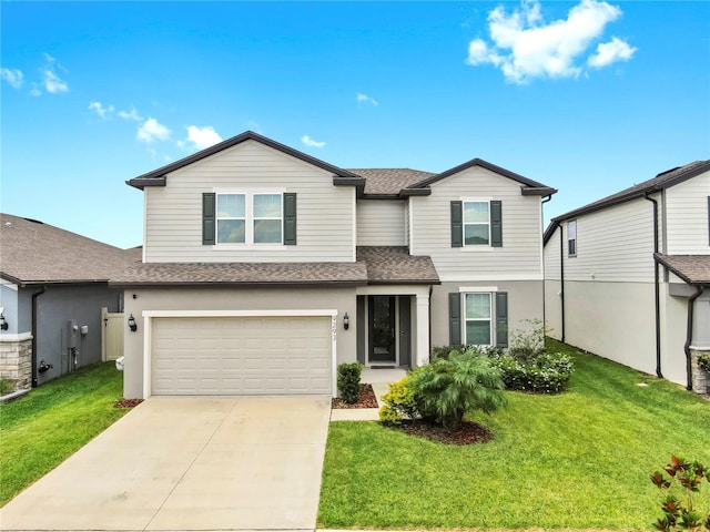 9293 Rally Spring Loop, Wesley Chapel, FL 33545 - traditional-style house featuring a shingled roof, an attached garage, driveway, a front lawn, and stucco siding