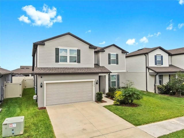 9293 Rally Spring Loop, Wesley Chapel, FL 33545 - view of front facade featuring an attached garage, driveway, stucco siding, a shingled roof, and a gate