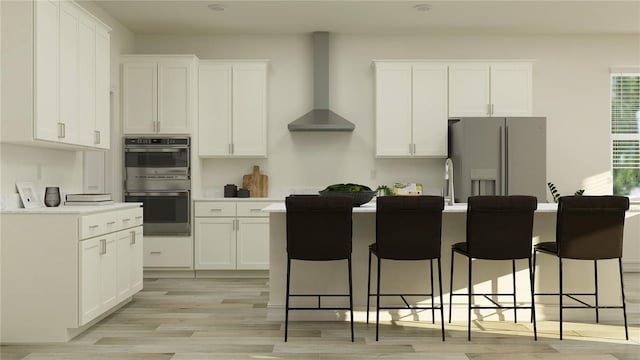 7541 E 116th St, Palmetto, FL 34221 - kitchen with white fridge with ice dispenser, wall chimney range hood, double oven, and white cabinets