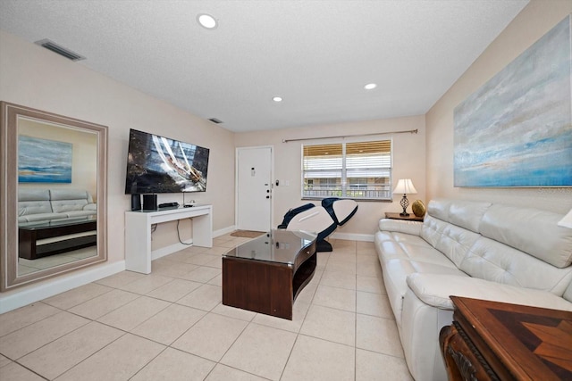 10038 62nd Ter N Unit 17, Saint Petersburg, FL 33708 - living room with light tile patterned floors, recessed lighting, and baseboards