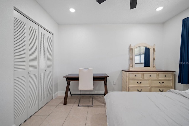 10038 62nd Ter N Unit 17, Saint Petersburg, FL 33708 - bedroom with light tile patterned floors, recessed lighting, a closet, a ceiling fan, and baseboards