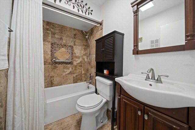 10038 62nd Ter N Unit 17, Saint Petersburg, FL 33708 - bathroom featuring toilet, shower / bath combo with shower curtain, and vanity