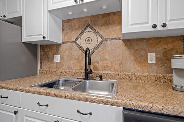 10038 62nd Ter N Unit 17, Saint Petersburg, FL 33708 - kitchen with a sink, dishwasher, light countertops, tasteful backsplash, and white cabinets