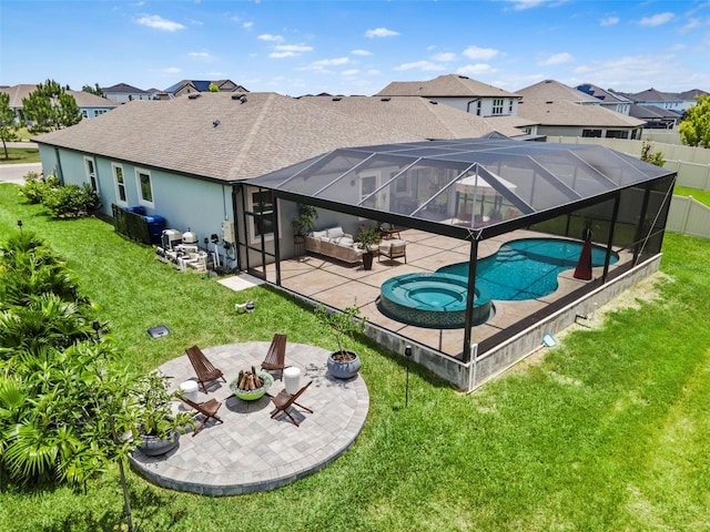 30801 Parrot Reef Ct, Wesley Chapel, FL 33545 - rear view of house with a fire pit, a patio area, a residential view, a shingled roof, and a pool with connected hot tub