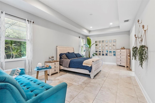 30801 Parrot Reef Ct, Wesley Chapel, FL 33545 - bedroom featuring multiple windows, a raised ceiling, recessed lighting, baseboards, and light tile patterned flooring