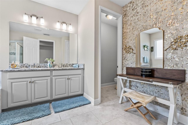 30801 Parrot Reef Ct, Wesley Chapel, FL 33545 - full bathroom featuring toilet, vanity, a stall shower, baseboards, and tile patterned flooring