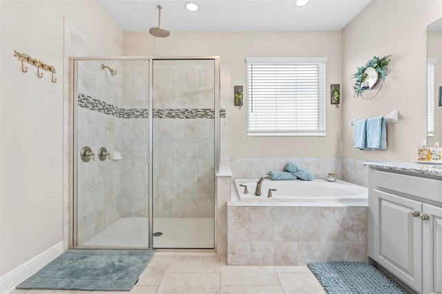 30801 Parrot Reef Ct, Wesley Chapel, FL 33545 - bathroom featuring vanity, a bath, a stall shower, tile patterned floors, and recessed lighting