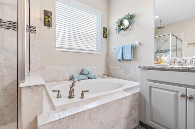 30801 Parrot Reef Ct, Wesley Chapel, FL 33545 - bathroom featuring a shower stall, vanity, and a garden tub