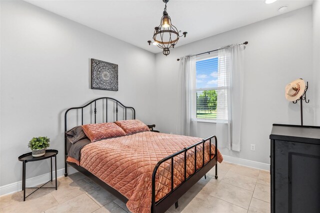 30801 Parrot Reef Ct, Wesley Chapel, FL 33545 - bedroom with baseboards and light tile patterned floors