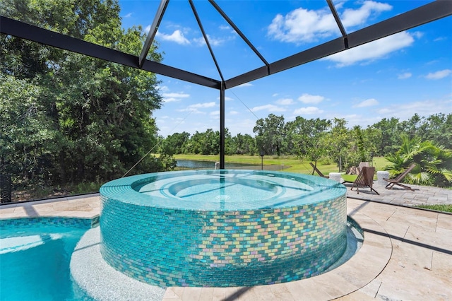 30801 Parrot Reef Ct, Wesley Chapel, FL 33545 - view of swimming pool with a patio, glass enclosure, view of wooded area, and a pool with connected hot tub