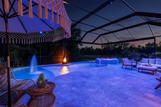 30801 Parrot Reef Ct, Wesley Chapel, FL 33545 - pool at twilight featuring a pool with connected hot tub and a patio