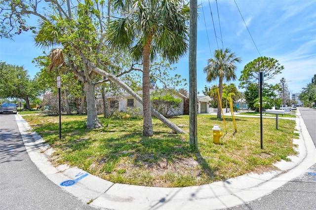 123 14th Ave, Indian Rocks Beach, FL 33785 - view of front of property with a front lawn