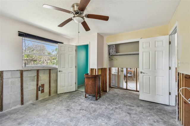 123 14th Ave, Indian Rocks Beach, FL 33785 - bedroom with unfinished concrete flooring, a closet, and a ceiling fan